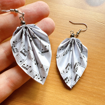 Lightweight origami leaf earrings featuring music notes