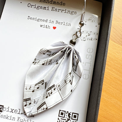 Artistic origami earrings inspired by music displayed