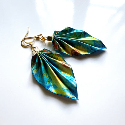 Leaf-shaped earrings with a colorful design on a white background