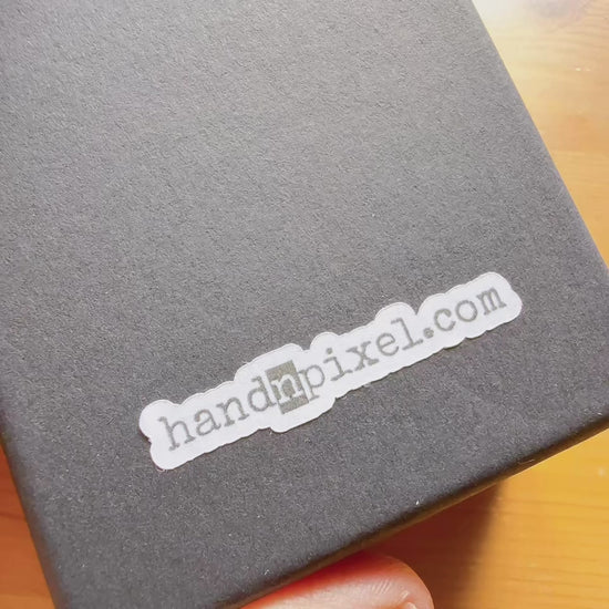 Handmade paper earrings with music-inspired design