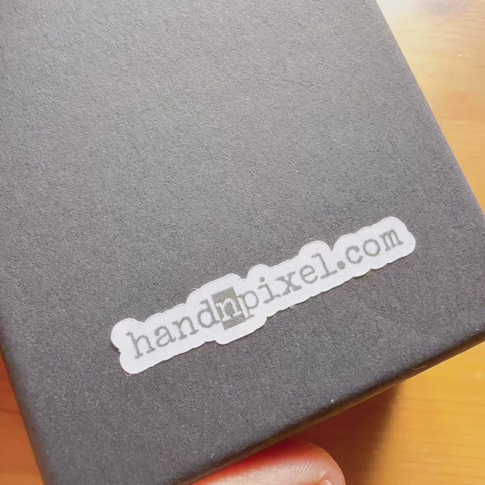 Handmade paper earrings with music-inspired design